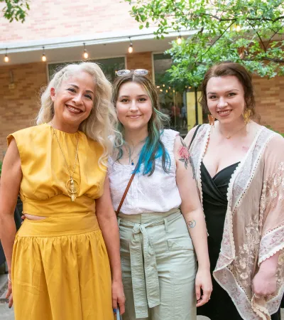 three people posing for photo